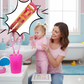 Woman and child brushing teeth together with a cartoon toothbrush in a bathroom setting - KWtoyszone | Proudly Canadian