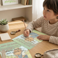 Flat lay of Chill Capy Weeks 4–6 journal pages including habit awareness, breathing exercise, and growth reflection with memory game cards.